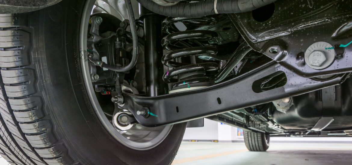 Technical photo. The structure of the modern car. Rear suspension. Shock absorber. Spring suspension.